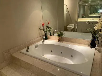 a bathroom with a bathtub and a sink