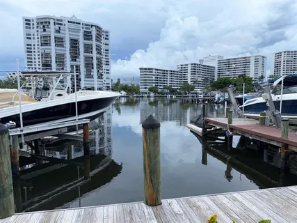 a terrace with wooden floor table and chairs