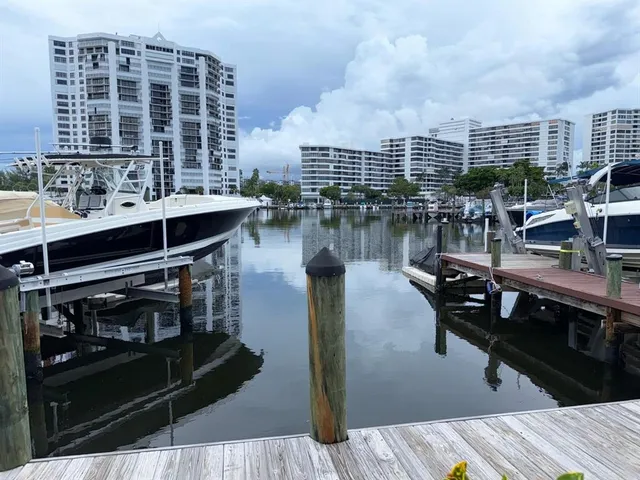 a terrace with wooden floor table and chairs