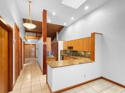 a view of a hallway with bathroom