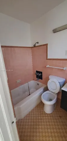 a bathroom with a toilet and a sink