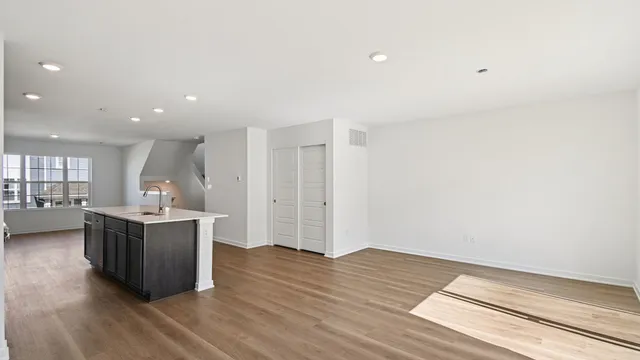 a view of kitchen with cabinets and wooden floor