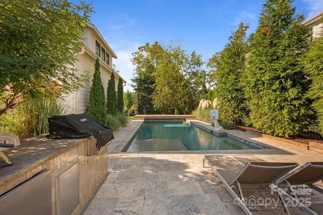 a view of a swimming pool with a yard