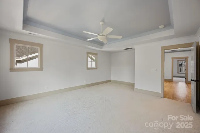 a bathroom with a granite countertop sink vanity and mirror