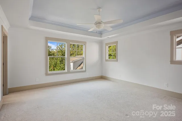 a bathroom with a granite countertop sink mirror toilet and bathtub