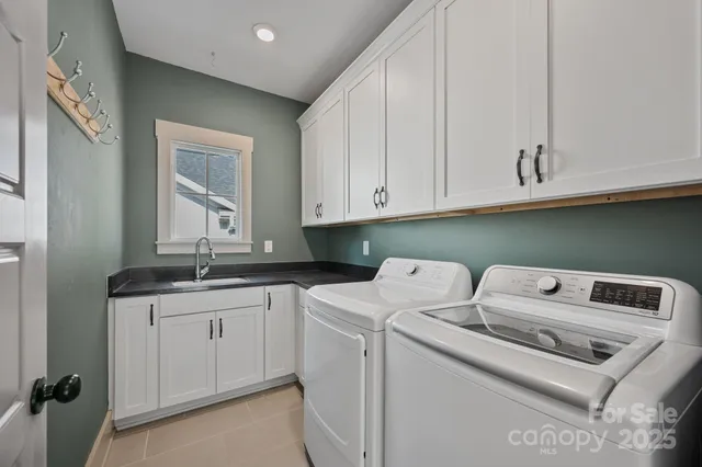 an aerial view of a house with a garden and street view