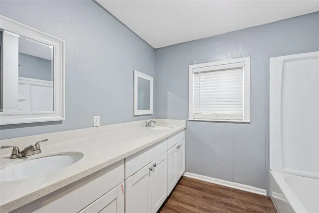 a bathroom with a sink and a window