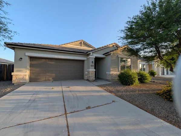 a front view of a house with garage