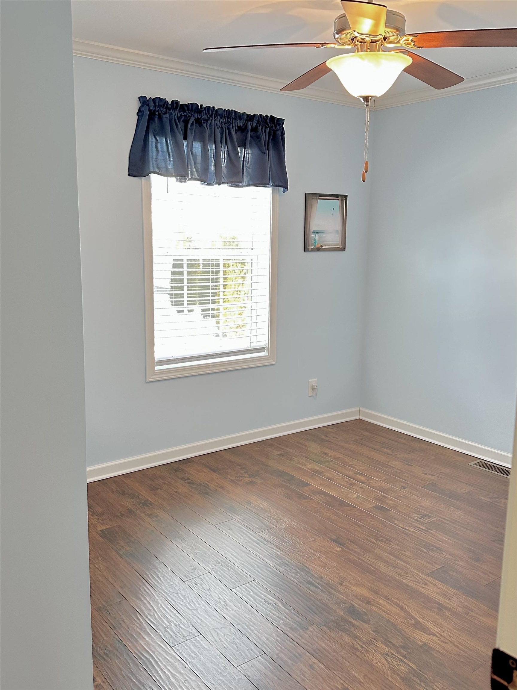 2058 Shore Road Seaville, NJ 08230 - Photo 31 of 36 an empty room with a window and wooden floor