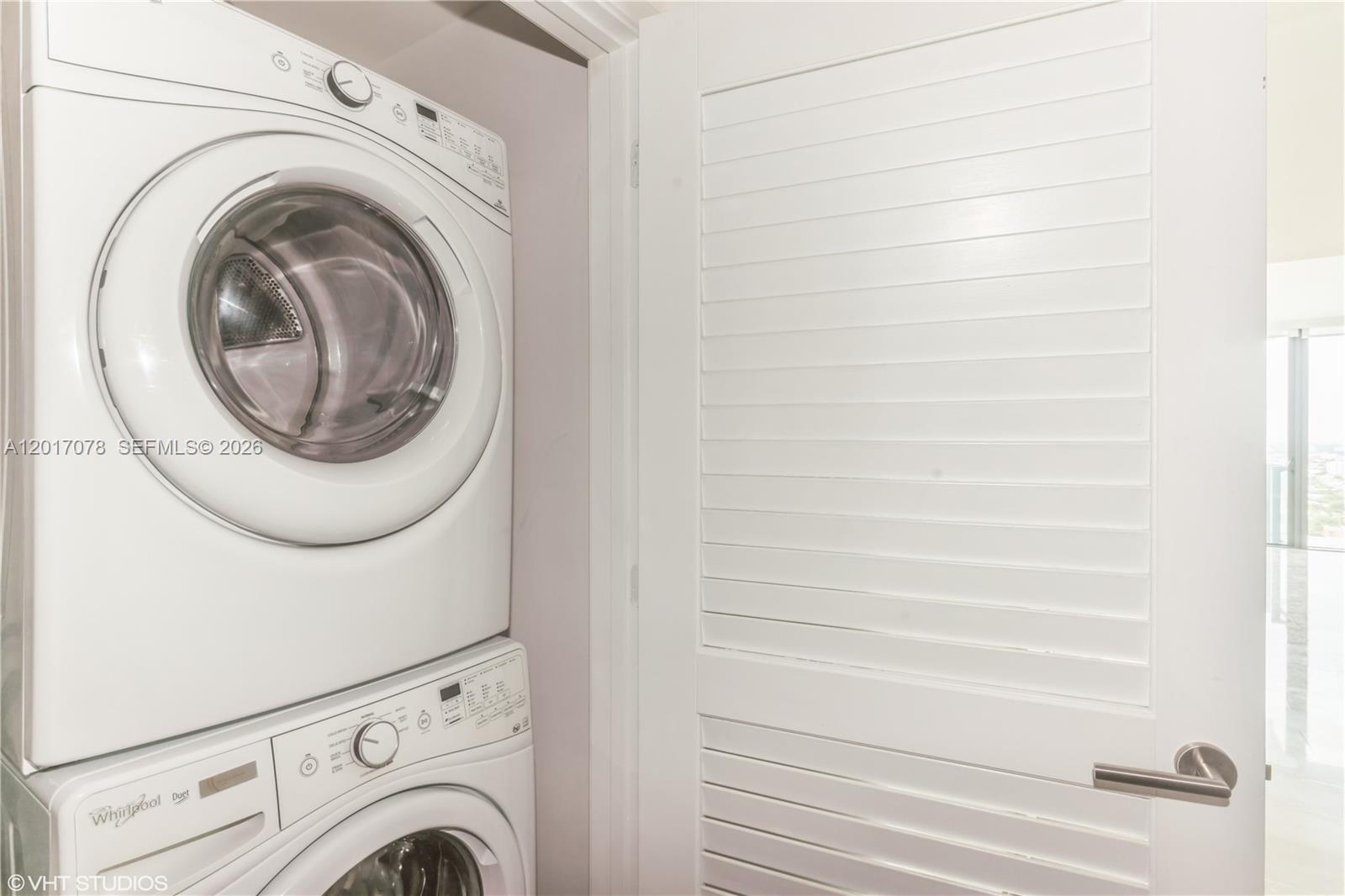 88 Southwest 7th Street, Unit 2508 Miami, FL 33130 - Photo 13 of 18 a utility room with dryer and washer
