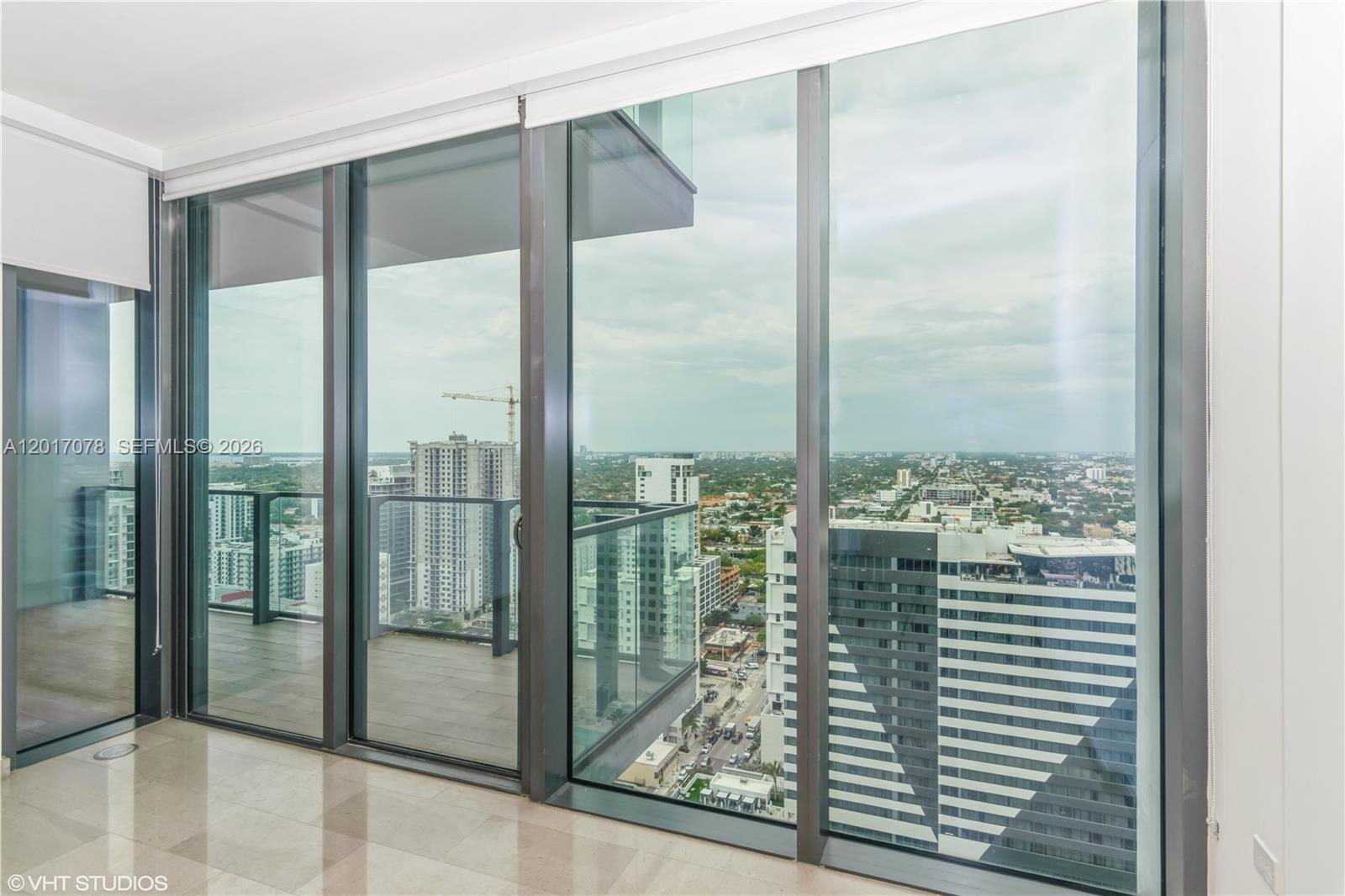 88 Southwest 7th Street, Unit 2508 Miami, FL 33130 - Photo 17 of 18 a view of a glass door and porch