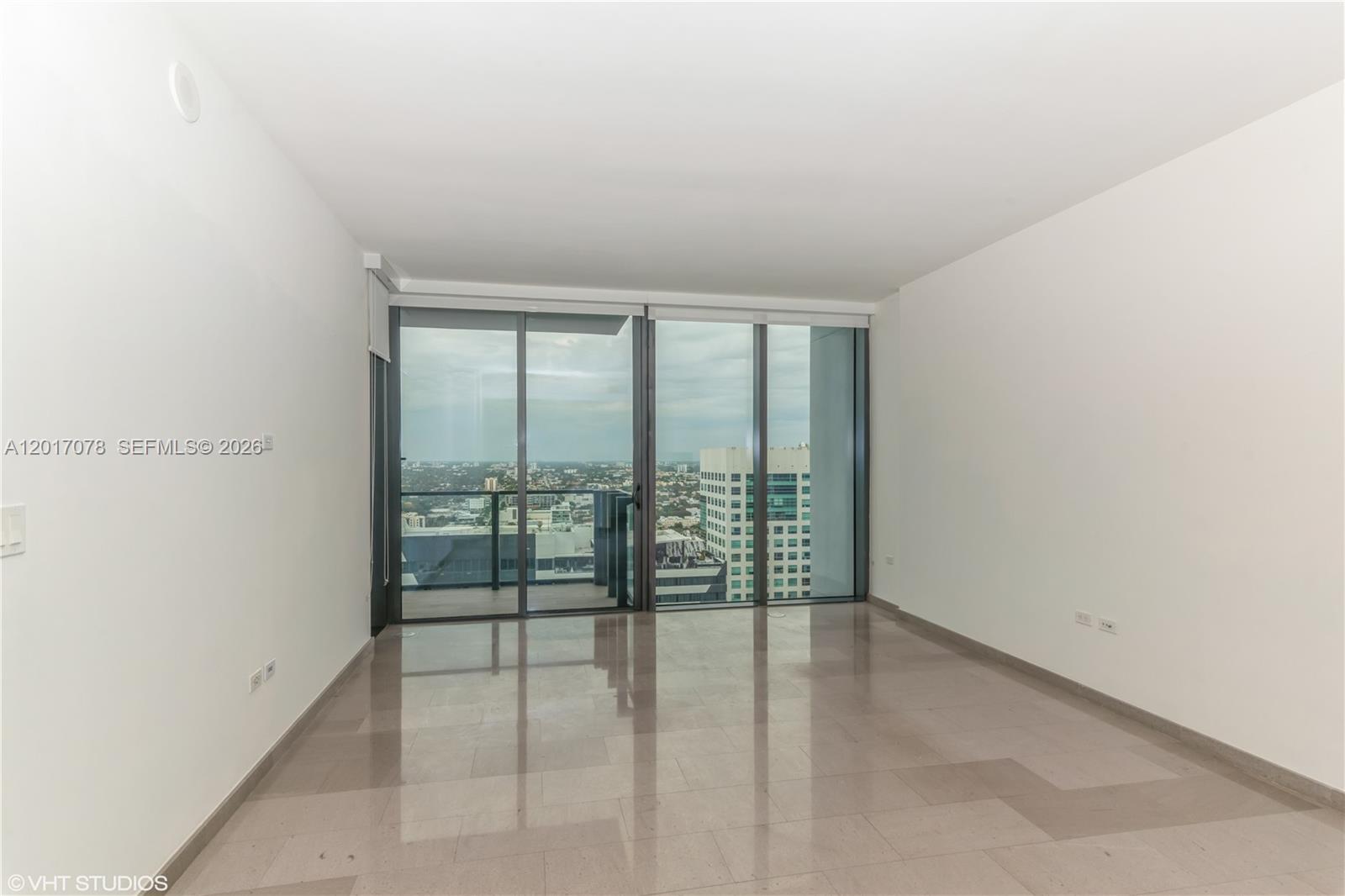 88 Southwest 7th Street, Unit 2508 Miami, FL 33130 - Photo 4 of 18 a view of an empty room and window