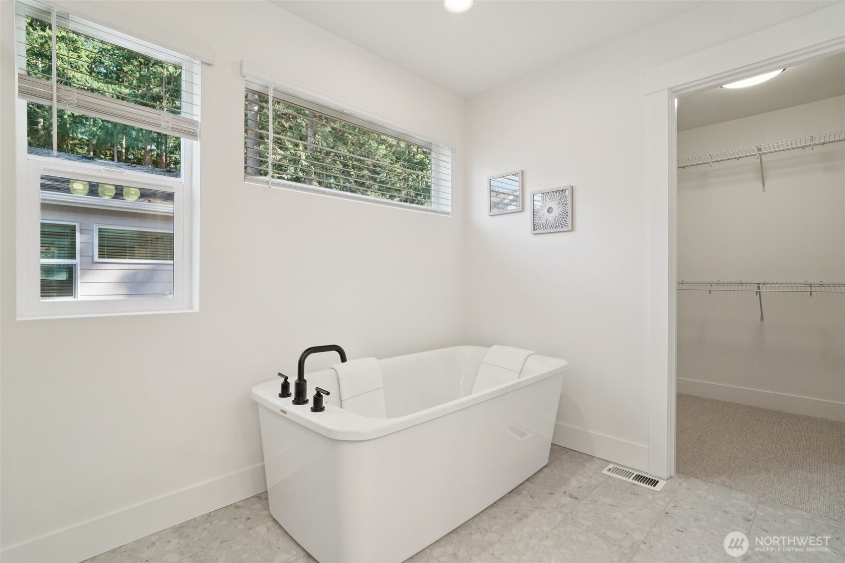 8014 222nd Street Southwest Edmonds, WA 98026 - Photo 19 of 29 a white bath tub sitting next to a window