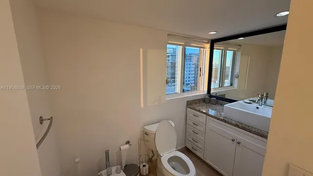 a room with a window and washer