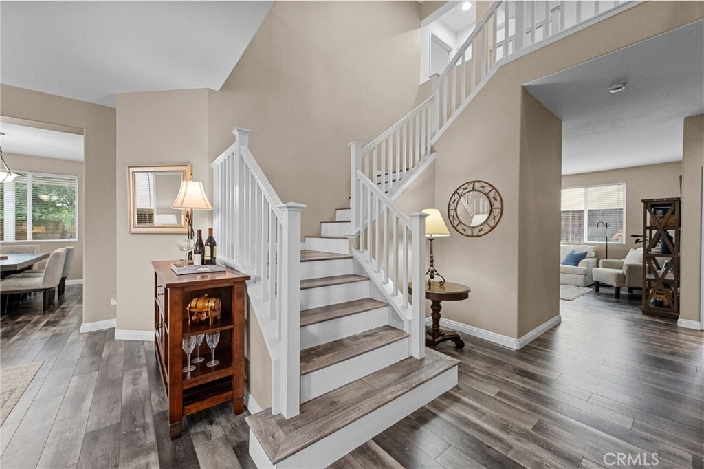 7220 Cumberland Place Rancho Cucamonga, CA 91739 - Photo 4 of 41 Elegant staircase with wood tread accents.