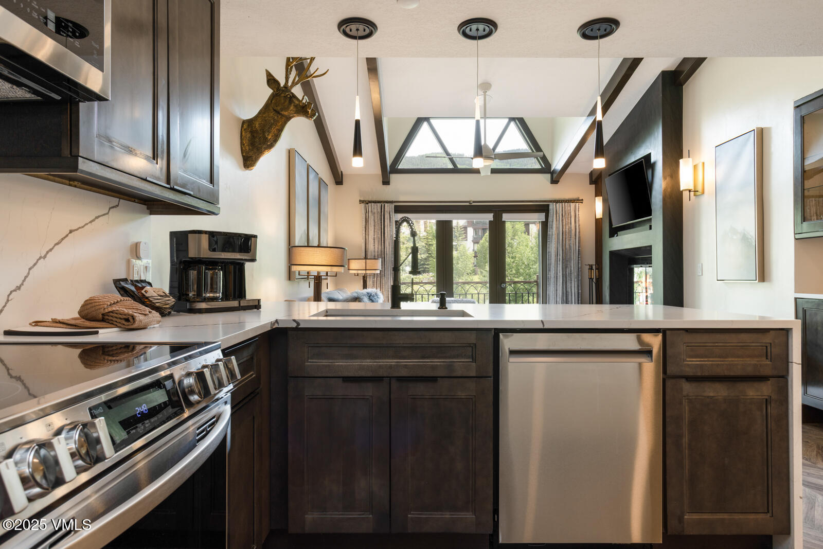 120 Offerson Road, Unit 3430 Beaver Creek, CO 81620 - Photo 12 of 36 a kitchen with stainless steel appliances granite countertop a stove and a sink