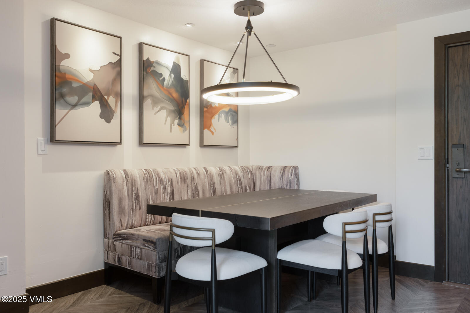 120 Offerson Road, Unit 3430 Beaver Creek, CO 81620 - Photo 14 of 36 a view of a dining room with furniture and wooden floor