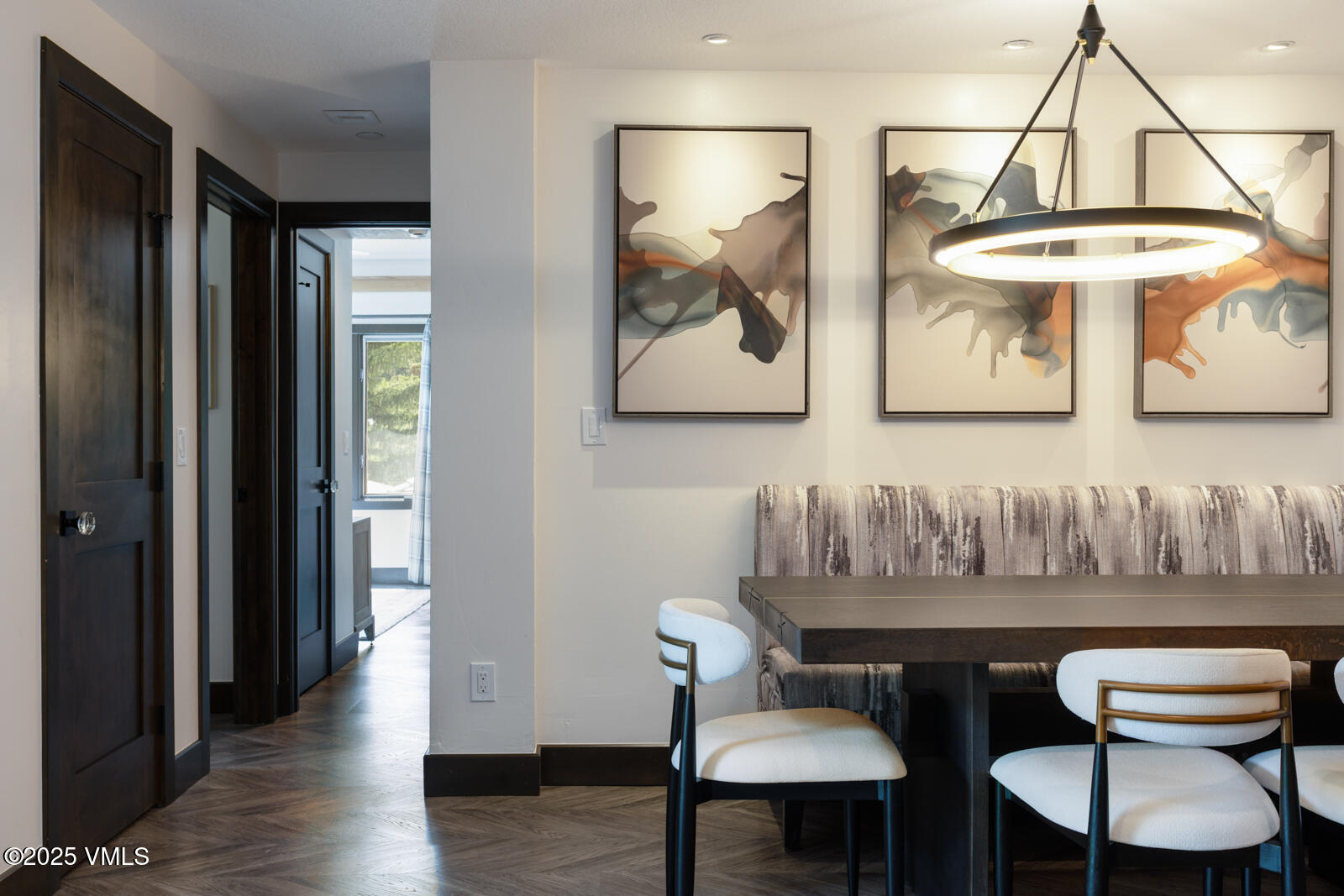 120 Offerson Road, Unit 3430 Beaver Creek, CO 81620 - Photo 15 of 36 a view of a dining room with furniture and wooden floor
