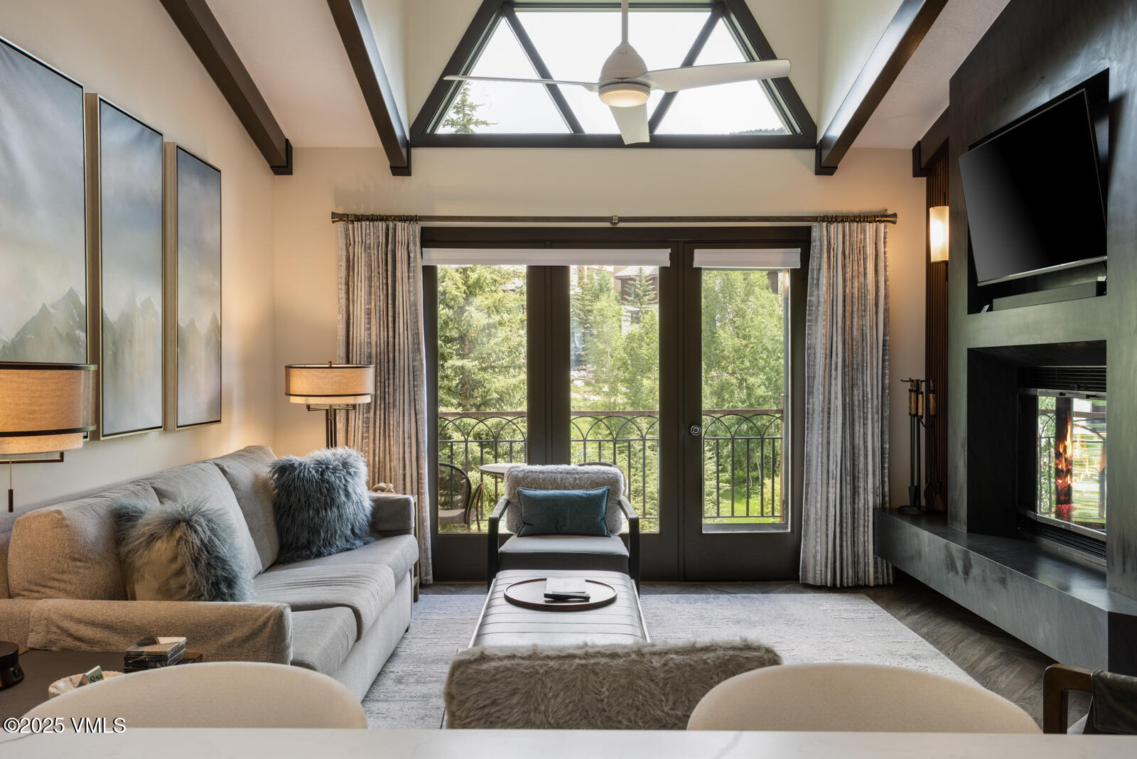 120 Offerson Road, Unit 3430 Beaver Creek, CO 81620 - Photo 3 of 36 a living room with furniture a flat screen tv and a fireplace