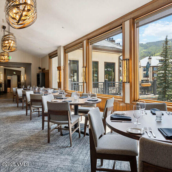 120 Offerson Road, Unit 3430 Beaver Creek, CO 81620 - Photo 31 of 36 a view of a dining room with furniture window and outside view