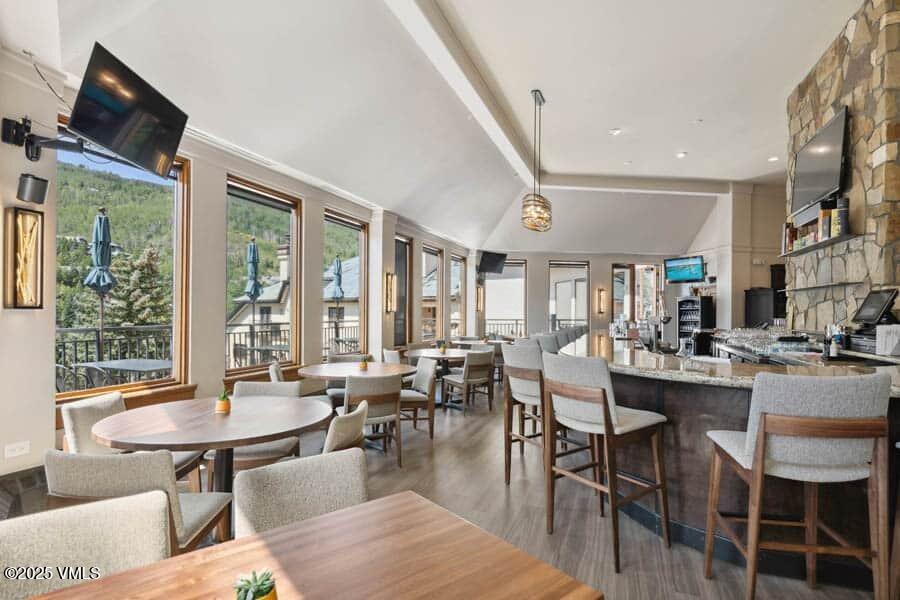 120 Offerson Road, Unit 3430 Beaver Creek, CO 81620 - Photo 32 of 36 a view of a dining room with furniture window and outside view