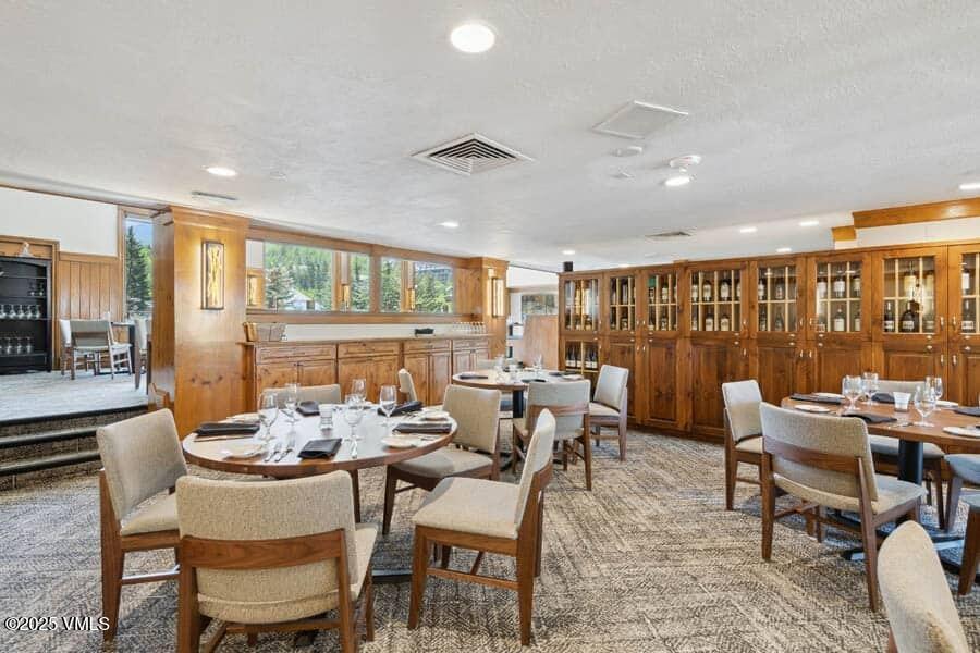 120 Offerson Road, Unit 3430 Beaver Creek, CO 81620 - Photo 33 of 36 a dining room with furniture and wooden floor