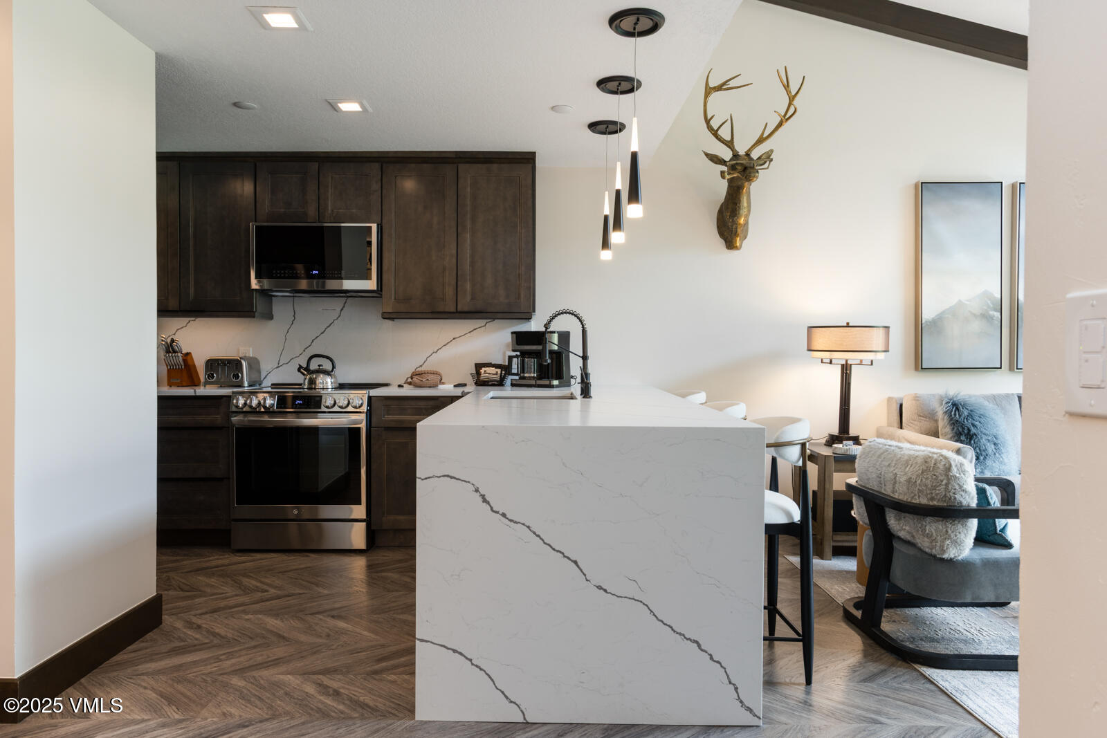 120 Offerson Road, Unit 3430 Beaver Creek, CO 81620 - Photo 9 of 36 a kitchen with a sink appliances and cabinets