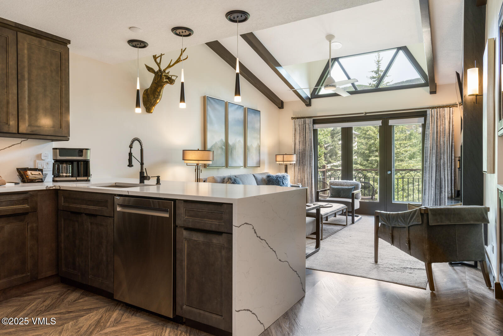 120 Offerson Road, Unit 3430 Beaver Creek, CO 81620 - Photo 10 of 36 a kitchen with a large window a sink and cabinets