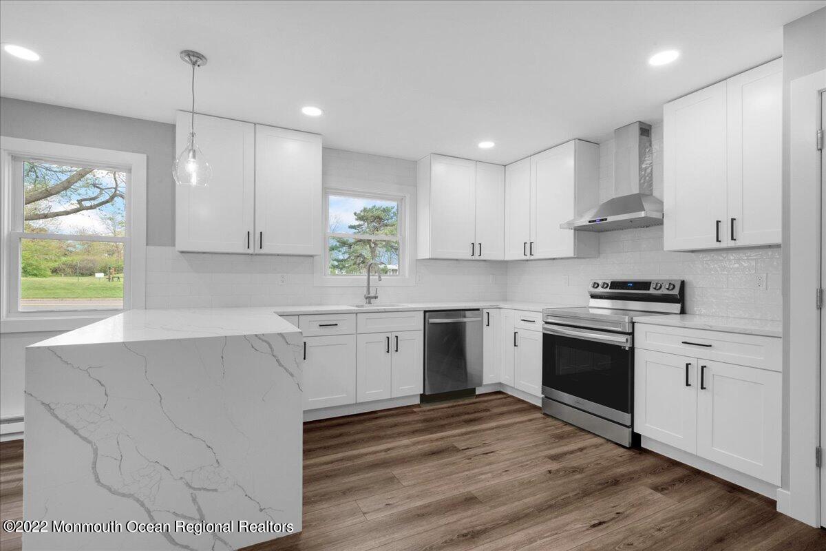 2 Bryant Road Brick, NJ 08724 - Photo 11 of 28 a kitchen with granite countertop white cabinets and white appliances
