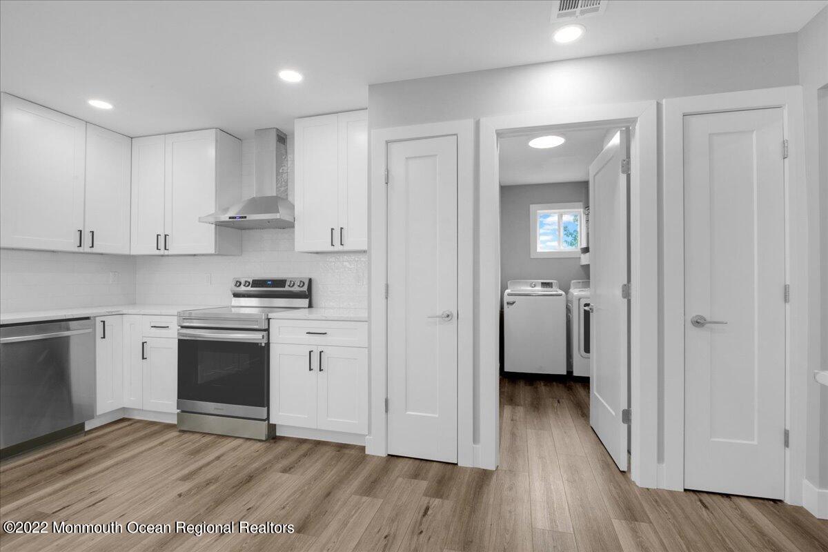 2 Bryant Road Brick, NJ 08724 - Photo 12 of 28 a view of a kitchen with a white stove top oven and sink