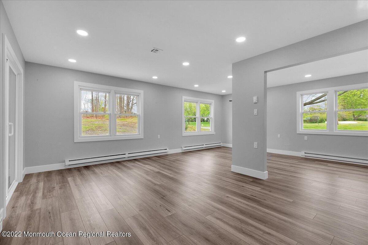 2 Bryant Road Brick, NJ 08724 - Photo 14 of 28 an empty room with wooden floor and windows