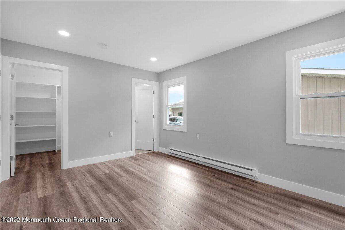 2 Bryant Road Brick, NJ 08724 - Photo 16 of 28 a view of empty room with wooden floor and fan