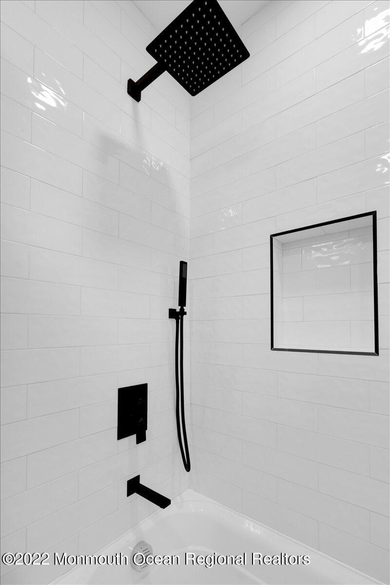 2 Bryant Road Brick, NJ 08724 - Photo 22 of 28 a picture of a bathroom with a shower and a sink