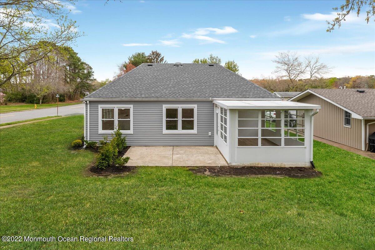 2 Bryant Road Brick, NJ 08724 - Photo 25 of 28 a front view of a house with a garden and yard
