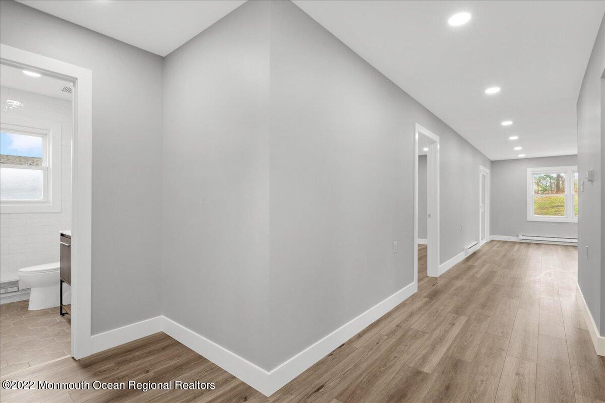 2 Bryant Road Brick, NJ 08724 - Photo 6 of 28 a view of hallway with a large window and wooden floor
