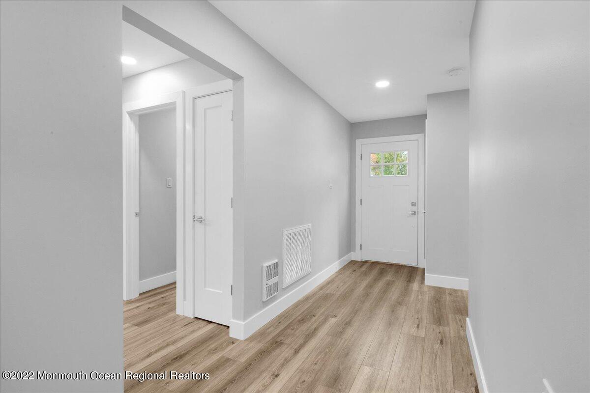 2 Bryant Road Brick, NJ 08724 - Photo 7 of 28 a view of hallway with wooden floor