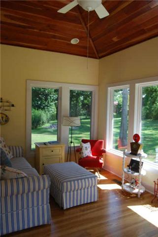 1640 Frye Road Columbia, TN 38401 - Photo 13 of 20 Georgous sunroom with bank of windows overlooking serene back yard. White oak flooring and vaulted ceiling with cherry wood.