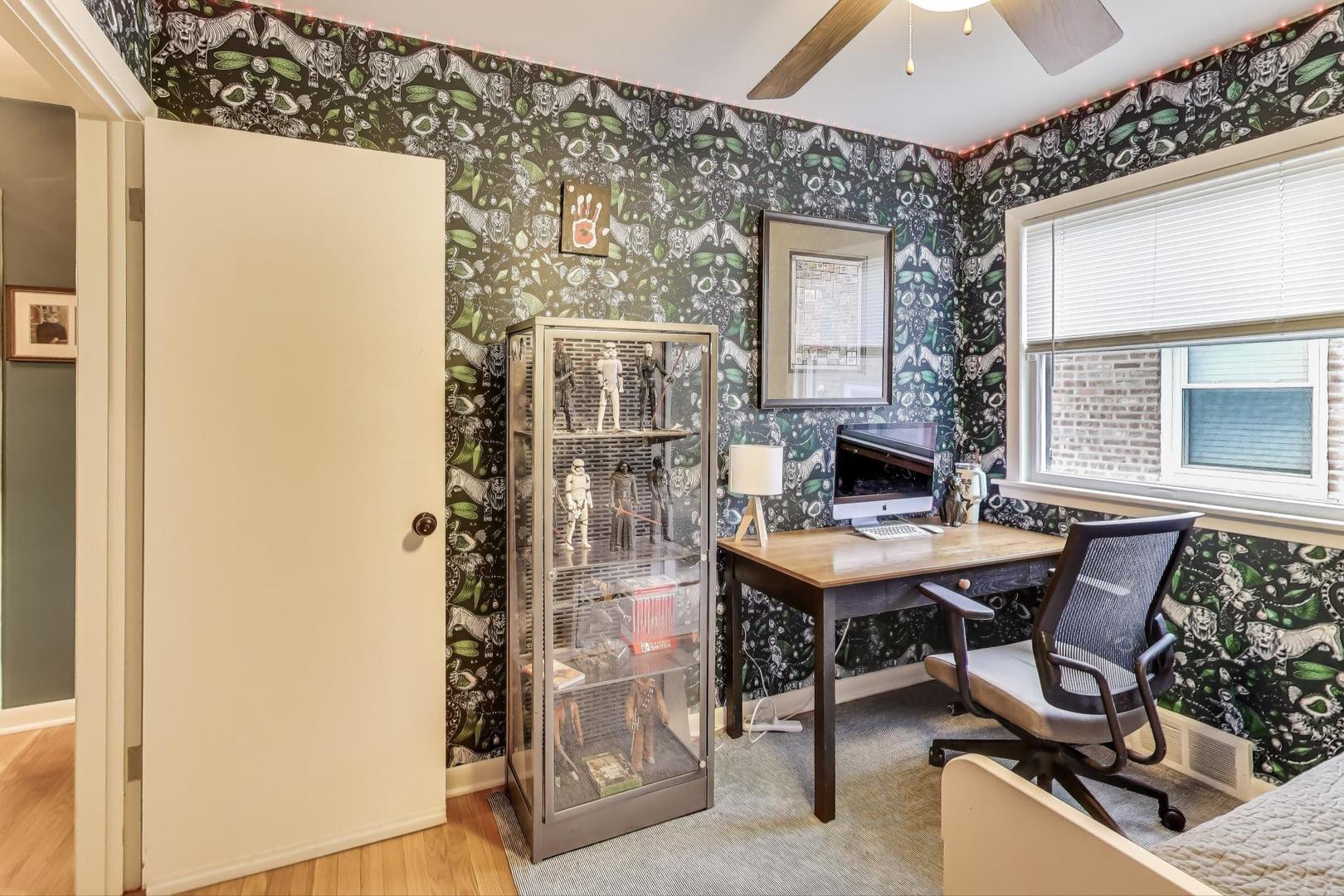 235 Richmond Street Evanston, IL 60202 - Photo 18 of 38 a view of a workspace with furniture and chandelier