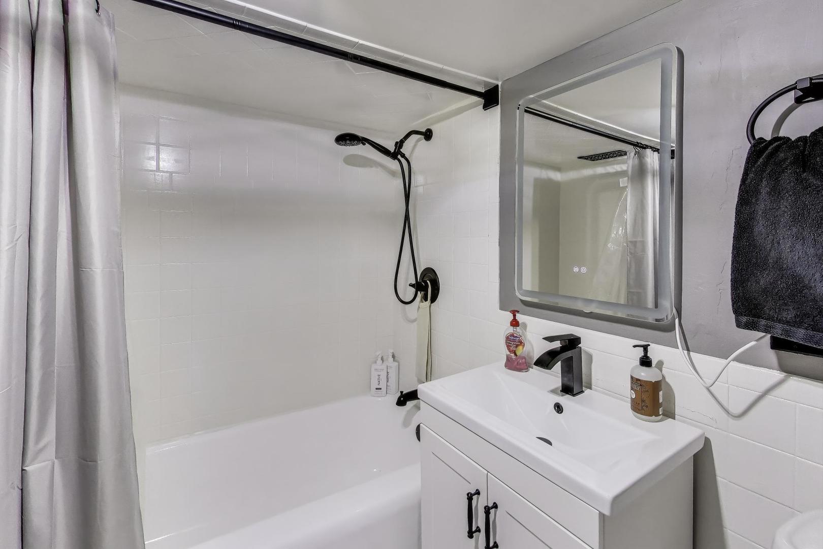 235 Richmond Street Evanston, IL 60202 - Photo 25 of 38 a bathroom with a sink and a mirror
