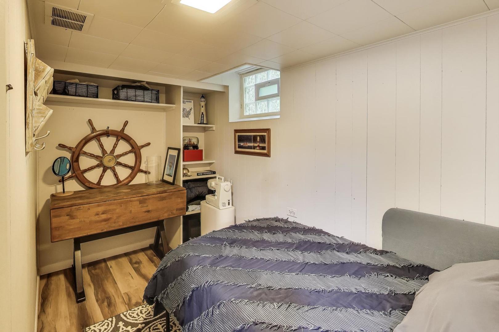 235 Richmond Street Evanston, IL 60202 - Photo 29 of 38 a bedroom with a bed and a dresser