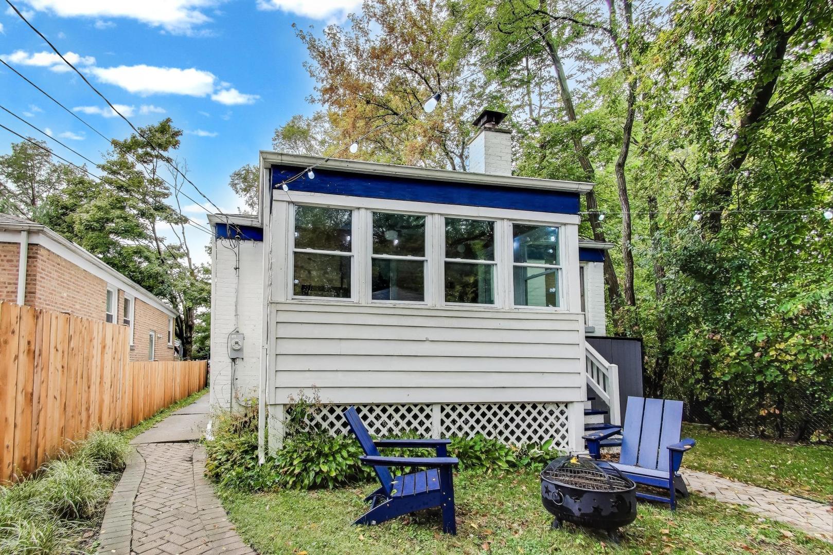 235 Richmond Street Evanston, IL 60202 - Photo 31 of 38 a front view of a house with a garden