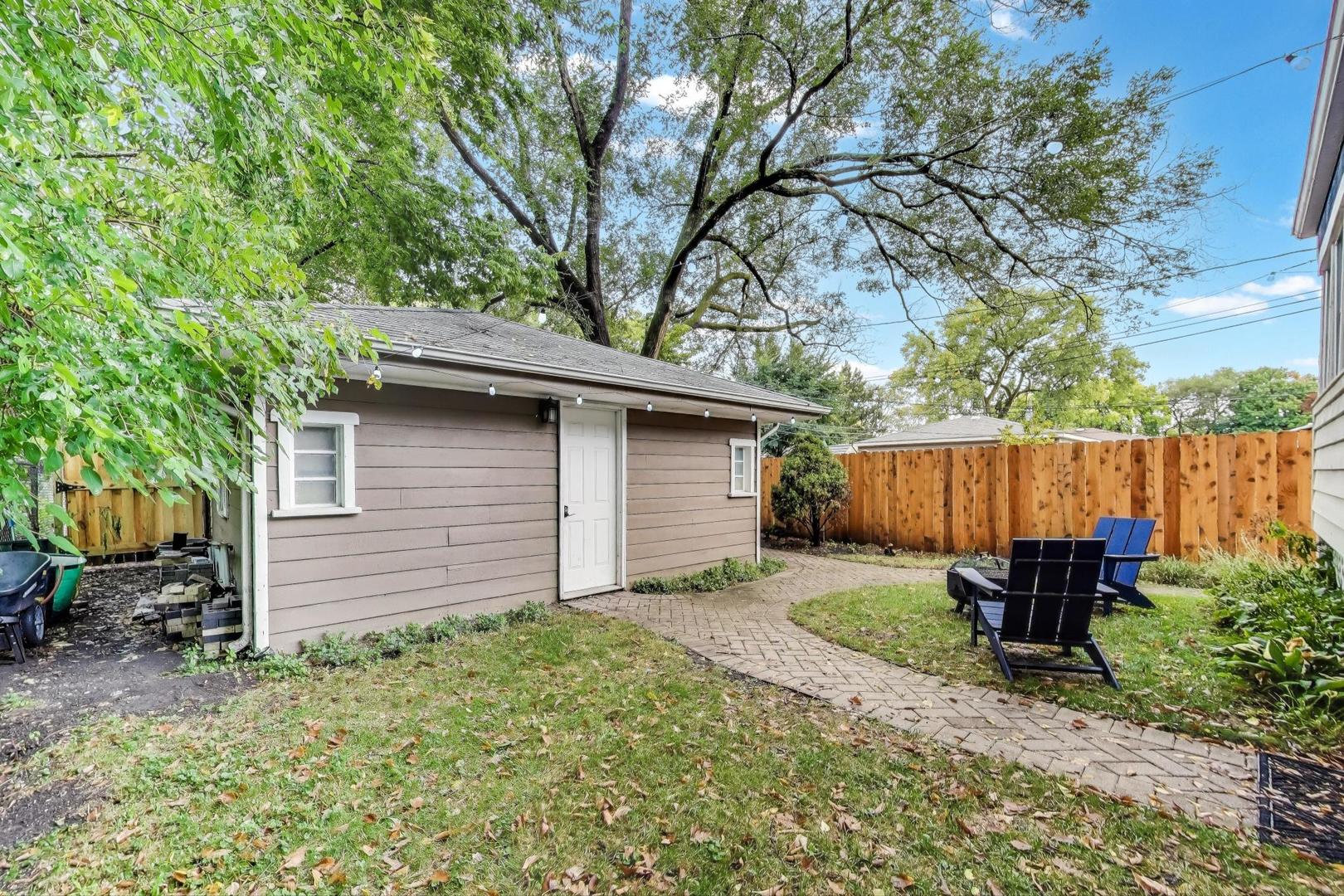 235 Richmond Street Evanston, IL 60202 - Photo 32 of 38 a backyard of a house with seating space