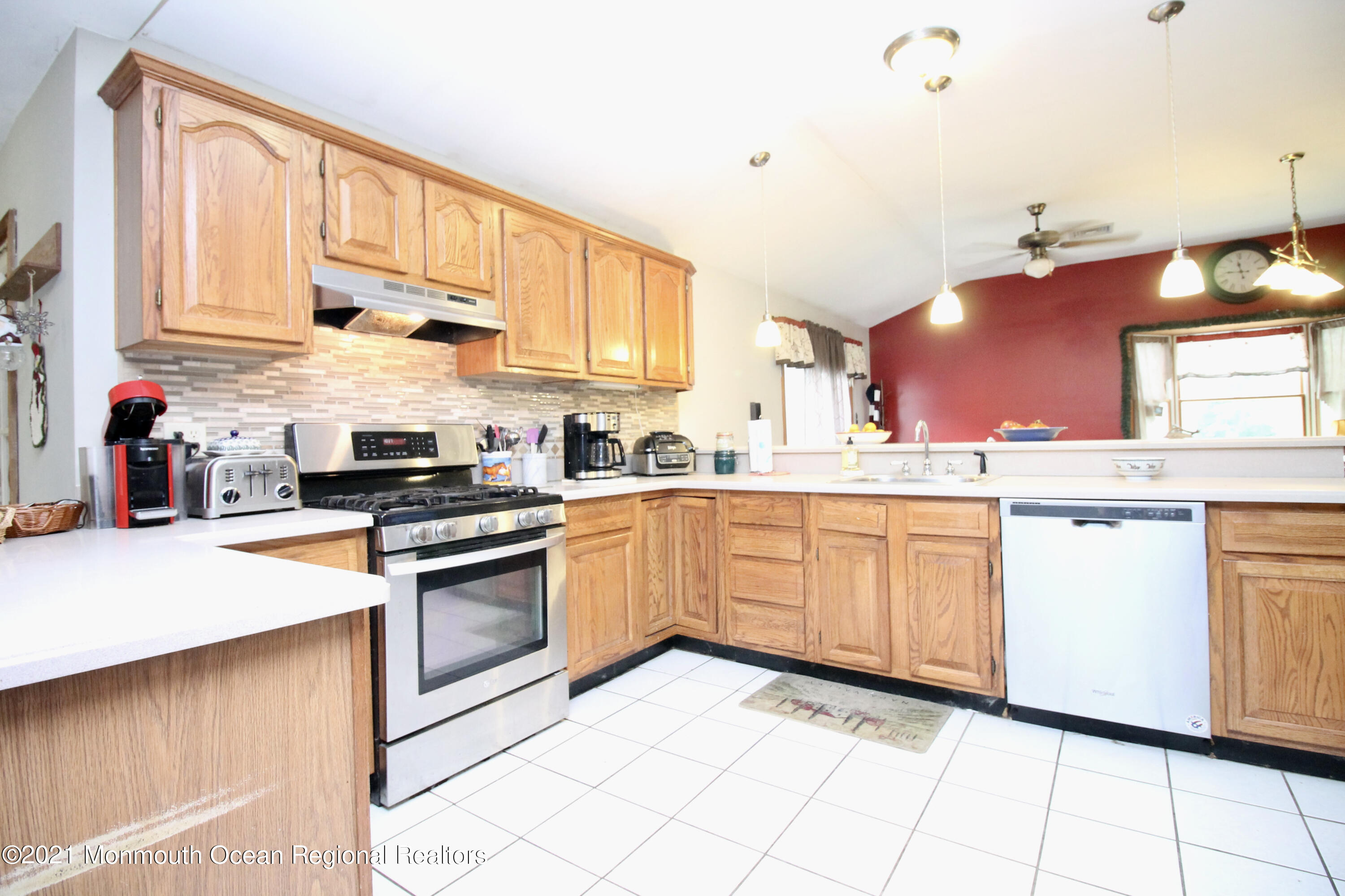 866 Monmouth Road Cream Ridge, NJ 08514 - Photo 11 of 39 a kitchen with granite countertop a sink stainless steel appliances and cabinets