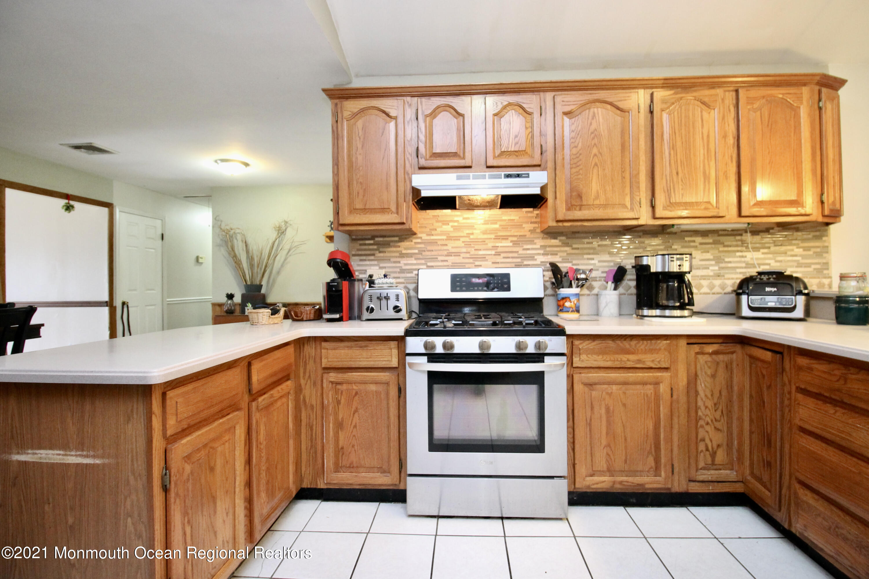 866 Monmouth Road Cream Ridge, NJ 08514 - Photo 12 of 39 a kitchen with stainless steel appliances granite countertop a sink and cabinets
