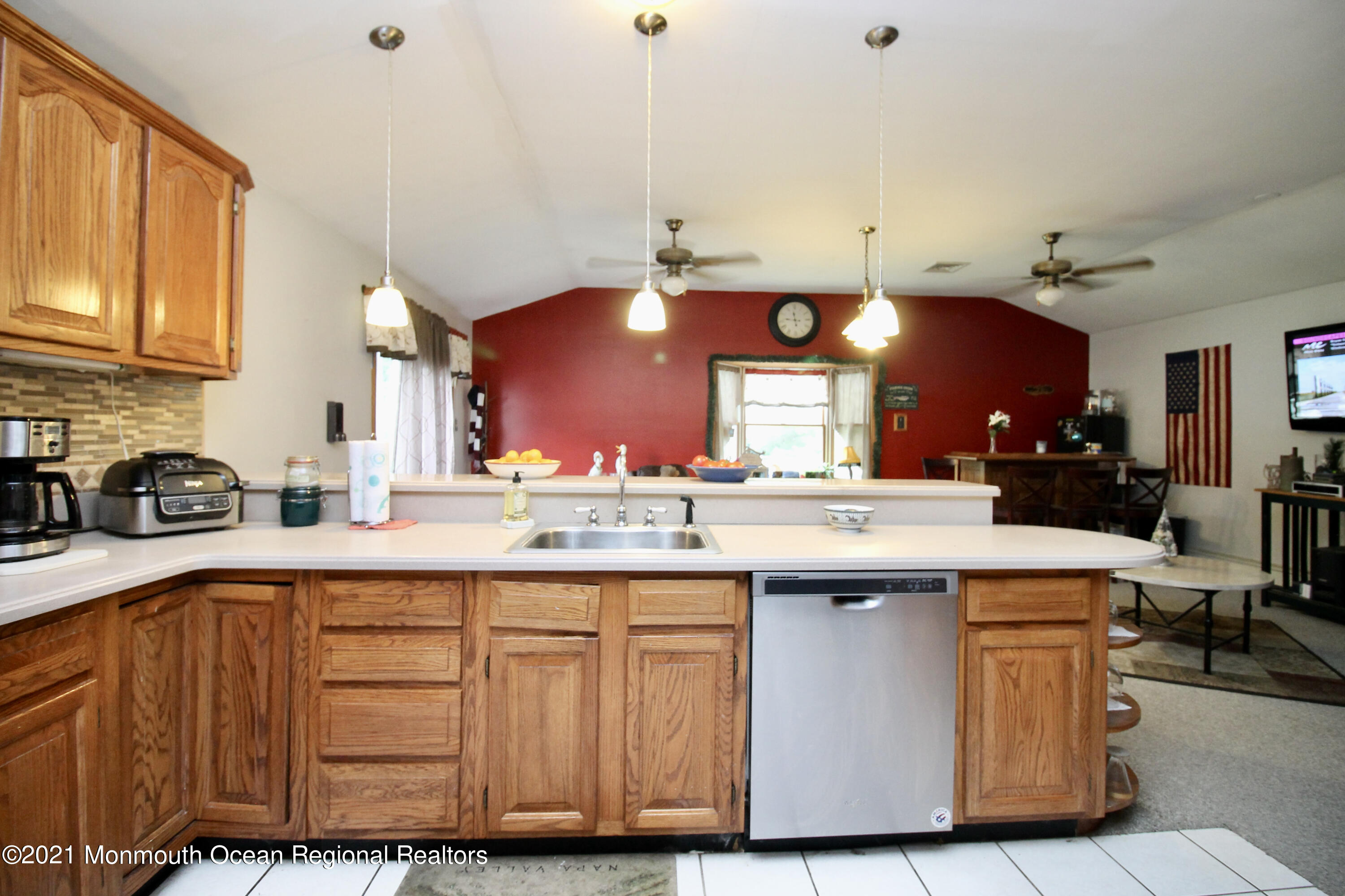 866 Monmouth Road Cream Ridge, NJ 08514 - Photo 13 of 39 a kitchen with kitchen island granite countertop wooden cabinets and a sink