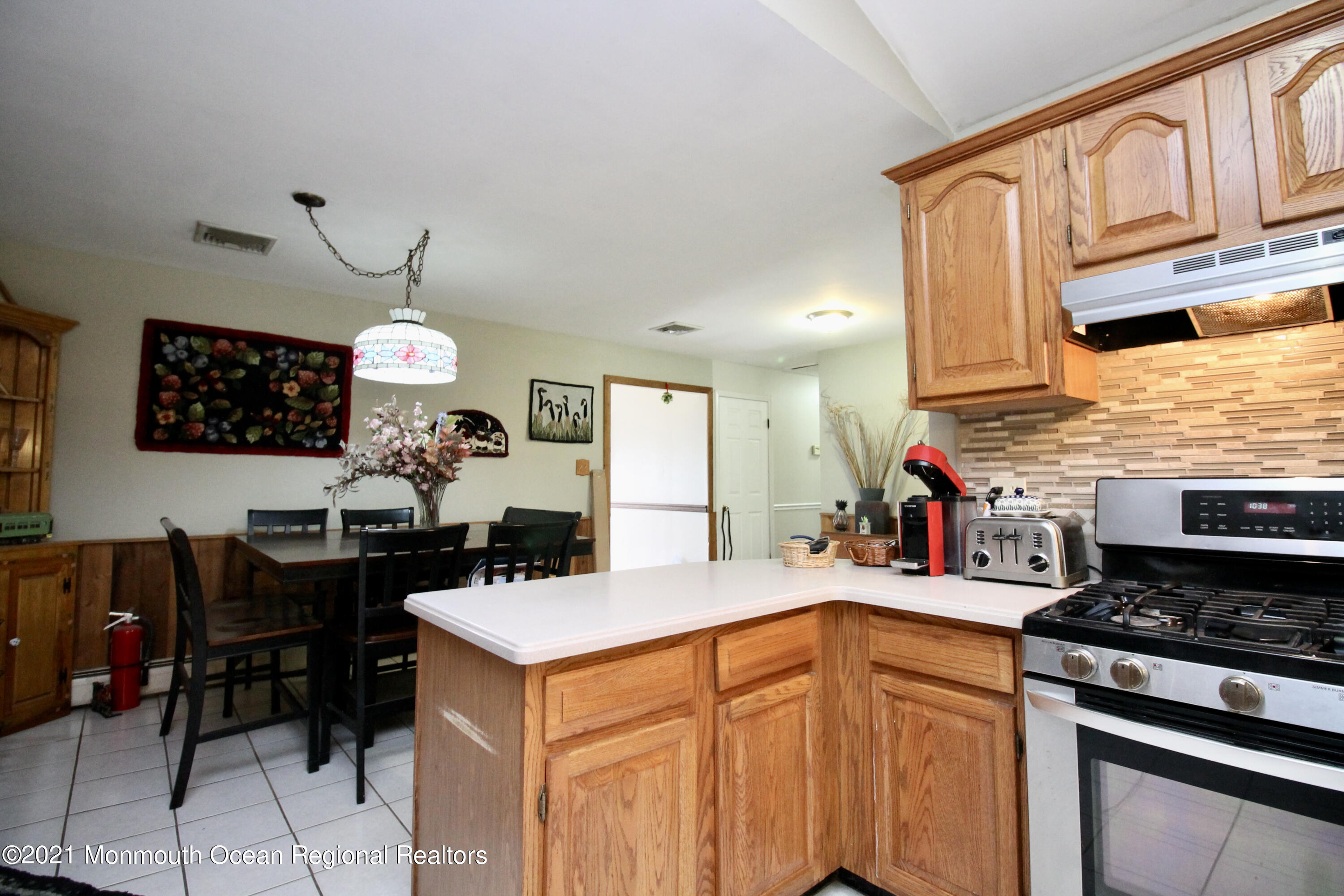 866 Monmouth Road Cream Ridge, NJ 08514 - Photo 14 of 39 a kitchen with a sink stove and cabinets