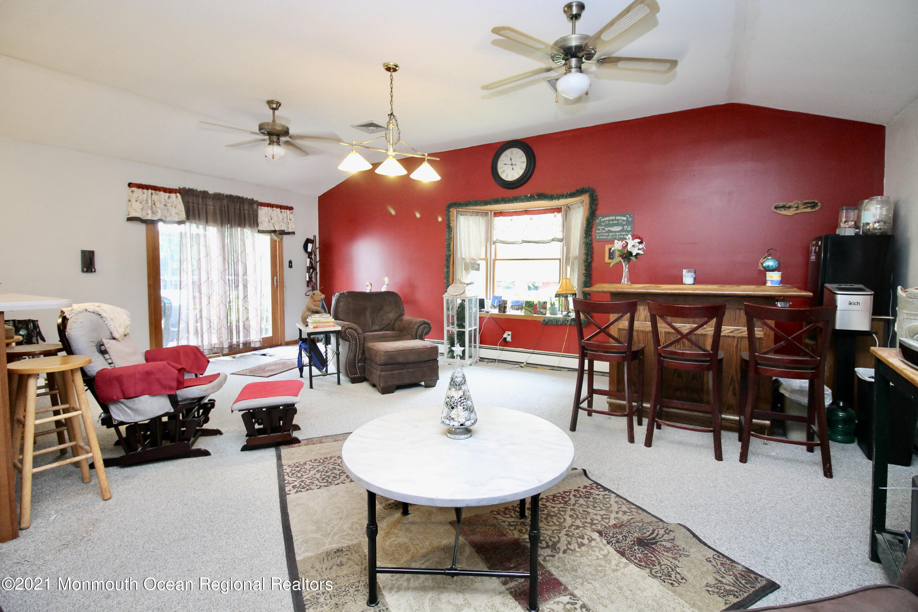 866 Monmouth Road Cream Ridge, NJ 08514 - Photo 17 of 39 a living room with furniture a rug and a chandelier