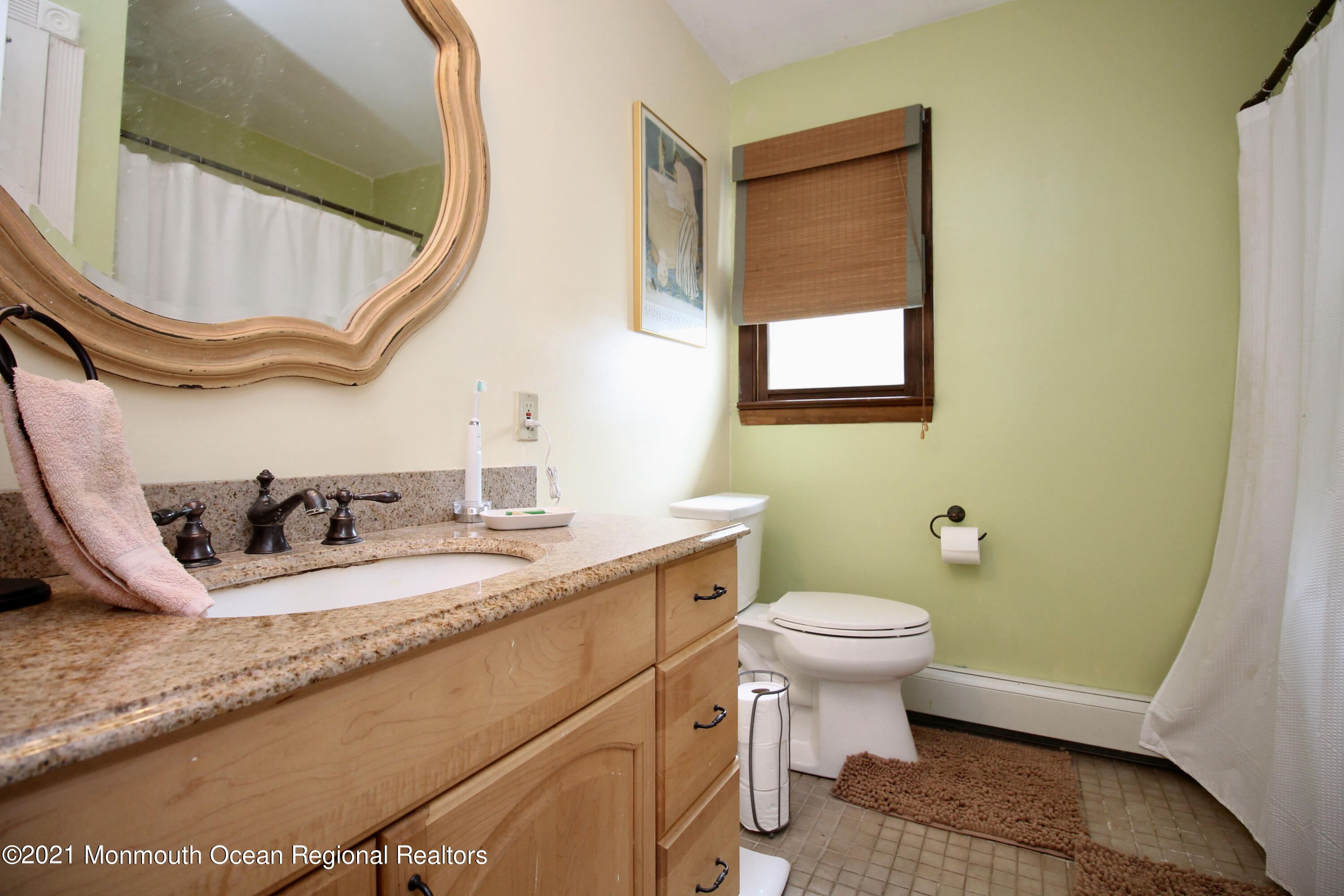 866 Monmouth Road Cream Ridge, NJ 08514 - Photo 22 of 39 a bathroom with a granite countertop sink mirror vanity and toilet