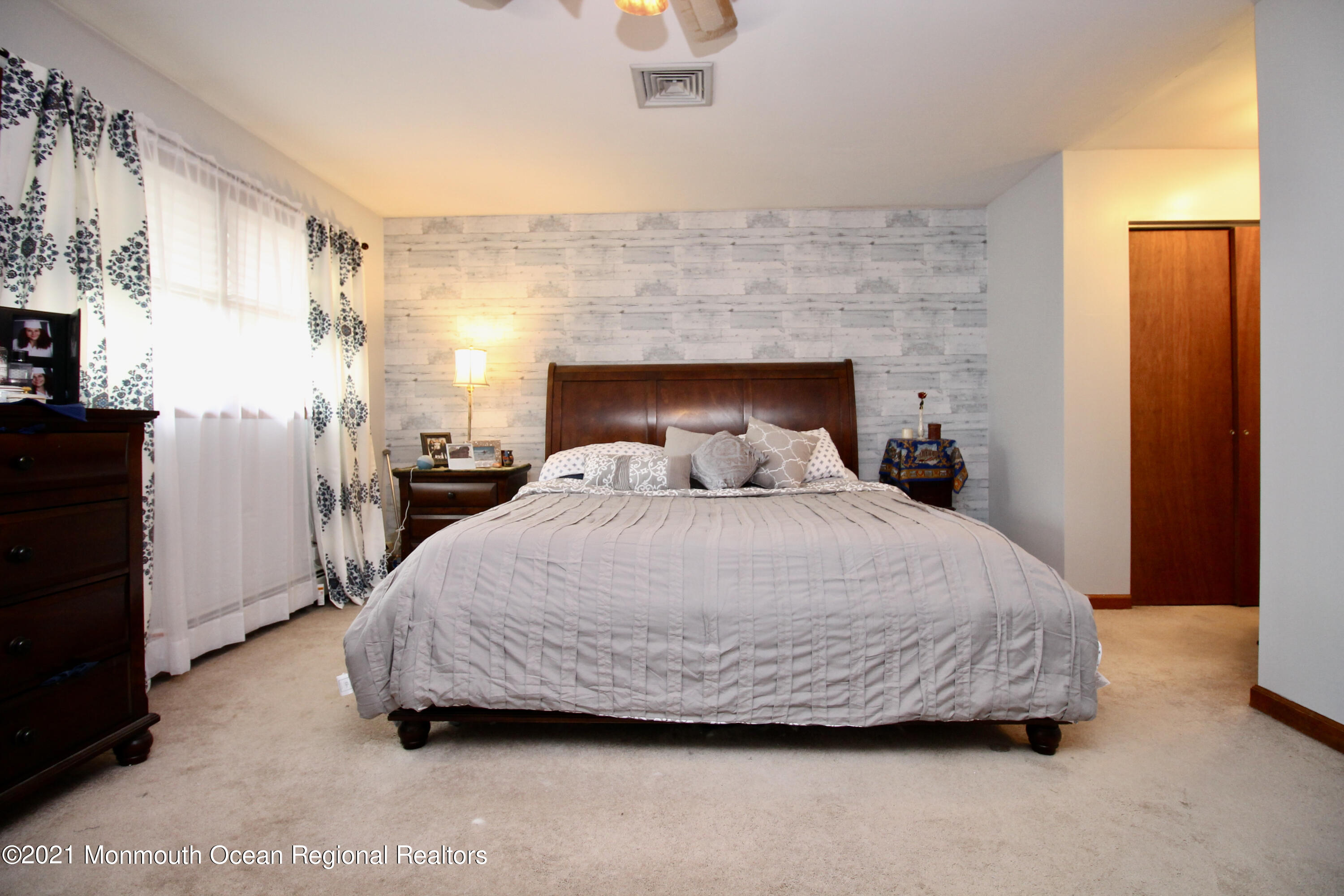 866 Monmouth Road Cream Ridge, NJ 08514 - Photo 26 of 39 a bedroom with a bed and a fireplace