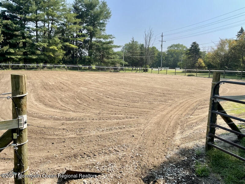 866 Monmouth Road Cream Ridge, NJ 08514 - Photo 34 of 39 a view of swimming pool with seating area and trees in the background